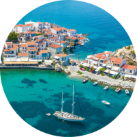 Aerial view of ocean and Kokkari village on Samos Island, where you can travel with travel insurance for Greece