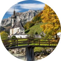 Get travel insurance for Germany before seeing this scenic countryside and mountain view of St. Sebastian church in Bavaria