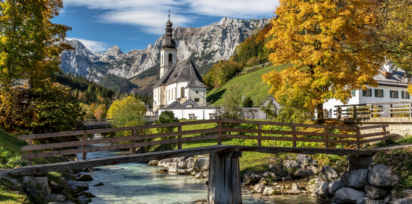 Get travel insurance for Germany before seeing this scenic countryside and mountain view of St. Sebastian church in Bavaria