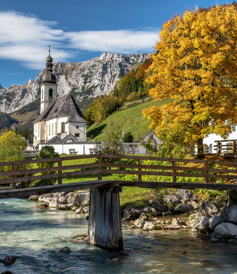 Get travel insurance for Germany before seeing this scenic countryside and mountain view of St. Sebastian church in Bavaria