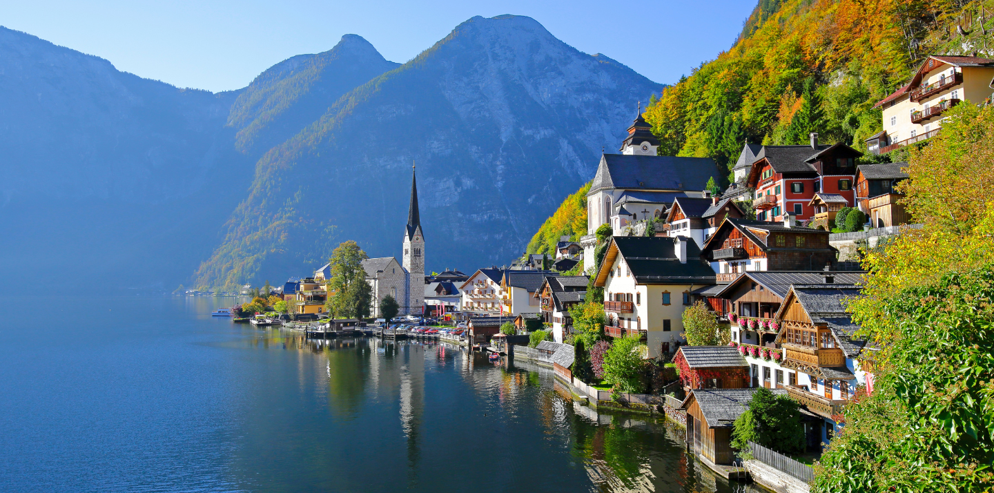 View of mountains and Hallstatt Village at Lake Hallstatt, highlighting travel insurance for Austria trips