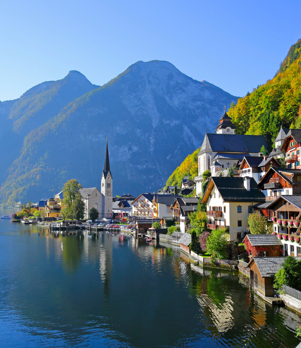 View of mountains and Hallstatt Village at Lake Hallstatt, highlighting travel insurance for Austria trips