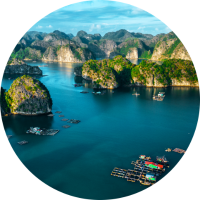 Aerial view of Ha Long Bay with boats and hills highlighting travel insurance for Vietnam trips
