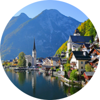 View of mountains and Hallstatt Village at Lake Hallstatt, highlighting travel insurance for Austria trips