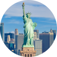 Statue of Liberty and New York City skyline highlighting travel insurance for New York trips