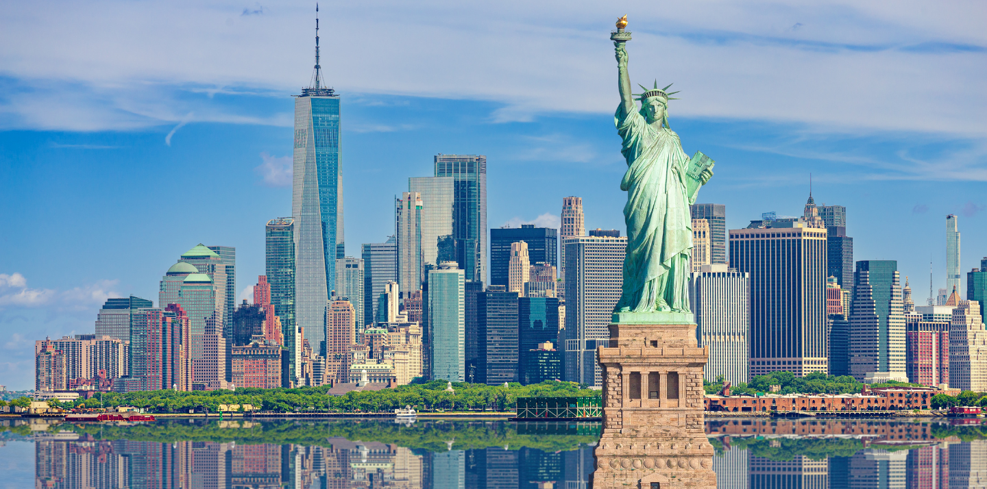 Statue of Liberty and New York City skyline highlighting travel insurance for New York trips