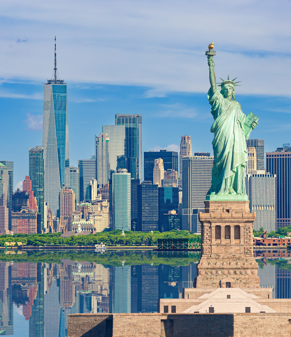 Statue of Liberty and New York City skyline highlighting travel insurance for New York trips