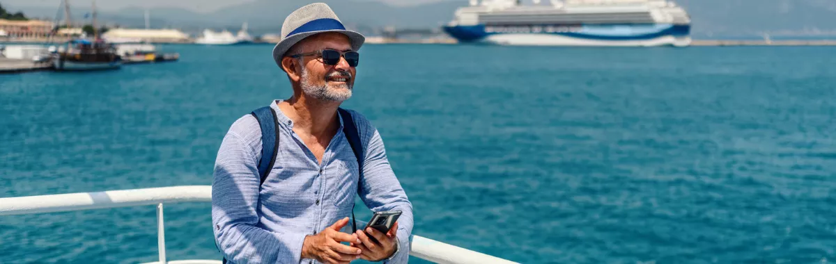 a man at sea, enjoying a cruise on a budget