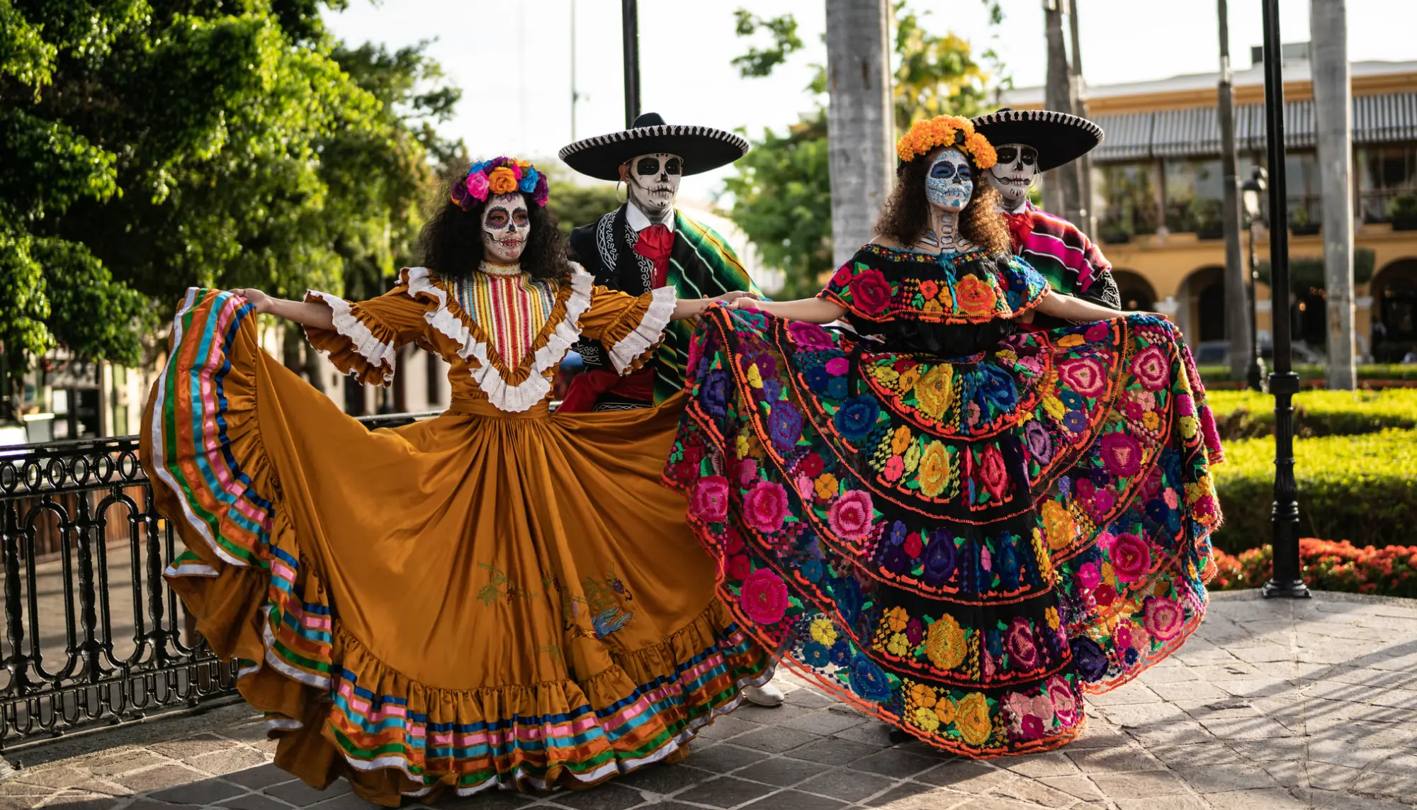 Men and women dressed up in traditional costumes for a dance performance on the Day of the Dead in Mexico 