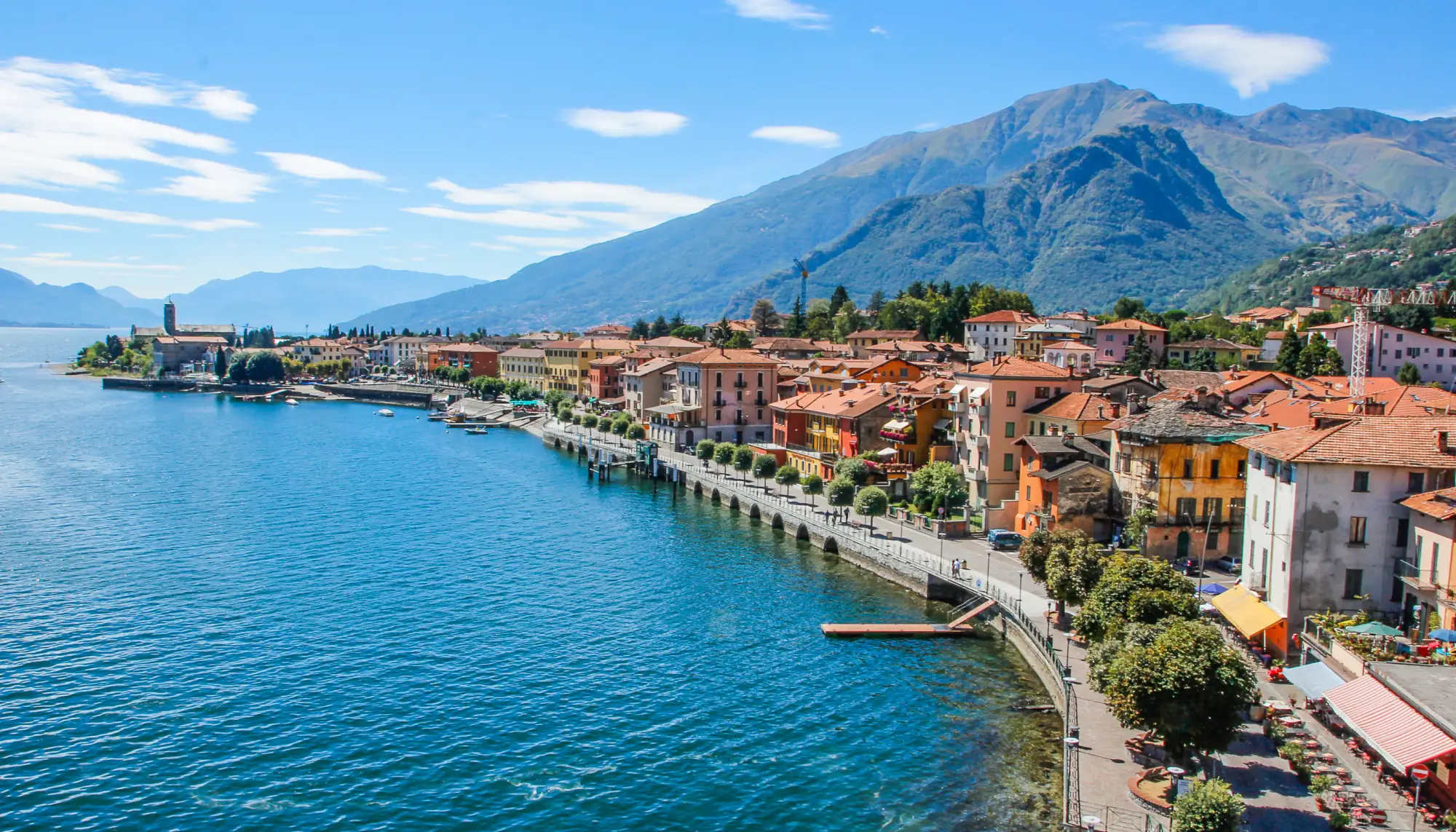 View of buildings and mountains at Lake Como highlighting travel insurance for Italy