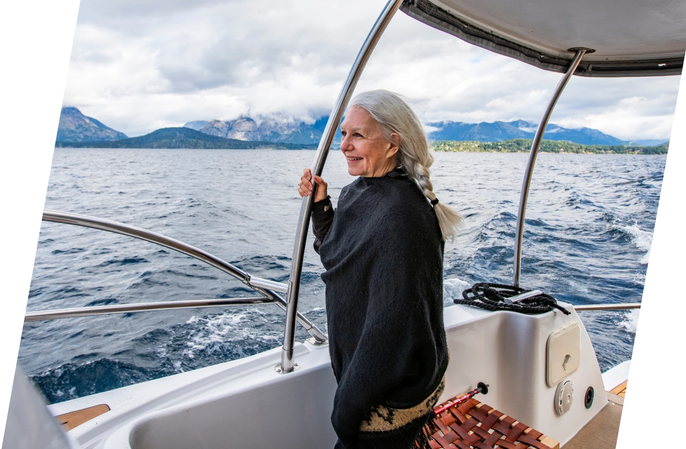 Senior woman smiling on a boat in Argentina with travel insurance for South America