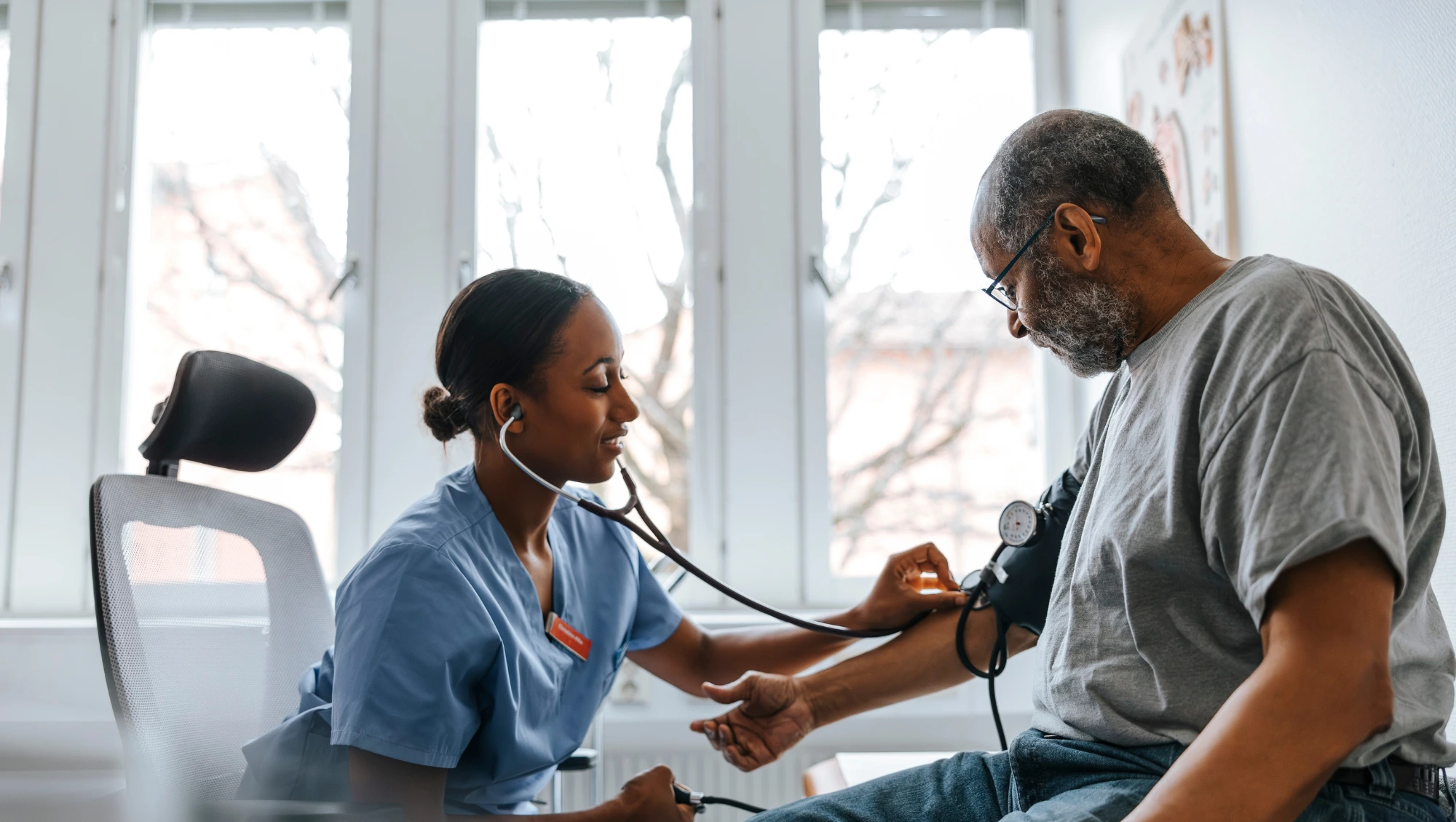 a patient receives travel healthcare abroad and sees a doctor on vacation, getting his heart and blood pressure checked