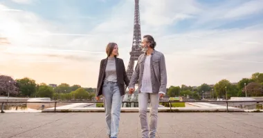 Middle-aged couple in Paris, one of the most romantic places in the world, holding hands in front of the Eiffel Tower