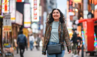 Woman strolling the streets of Japan, wondering "What do I do in an earthquake in this region?"