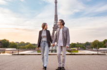 Middle-aged couple in Paris, one of the most romantic places in the world, holding hands in front of the Eiffel Tower