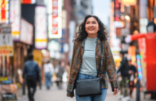 Woman strolling the streets of Japan, wondering "What do I do in an earthquake in this region?"