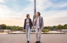 Middle-aged couple in Paris, one of the most romantic places in the world, holding hands in front of the Eiffel Tower